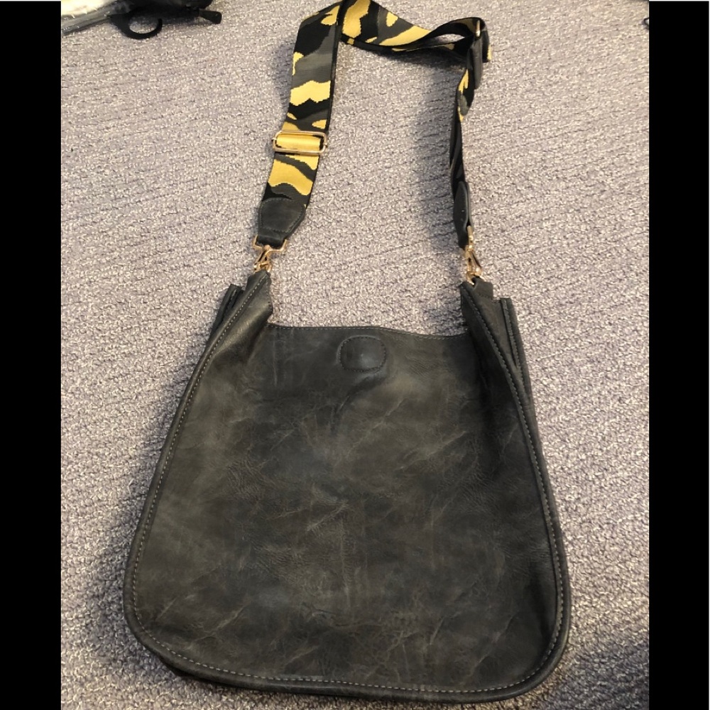 Ah-dorned bag w guitar strap